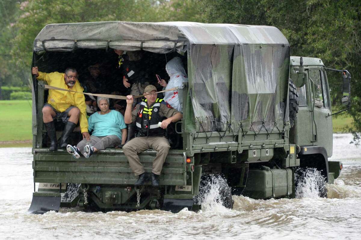 Residents of the Cinco Ranch and Kelliwood areas of Fort Bend and Harris counties evacuate from the west side of the Barker Reservoir along Westheimer Parkway in Katy, Texas on August 29, 2017.