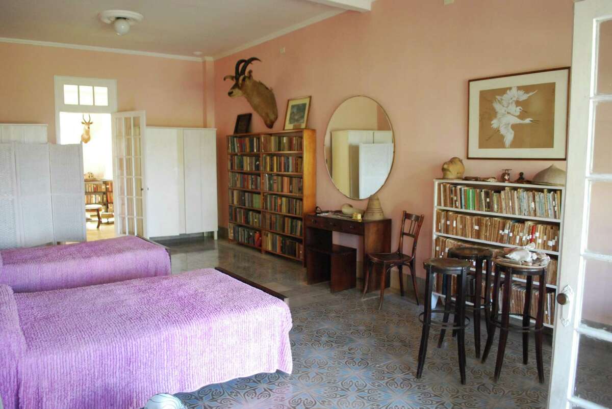 The master bedroom at Finca Vigia, outside Havana, where Hemingway lived until 1959. Now known as Museo Ernest Hemingway, the house remains a popular draw for tourists from around the world. All the objects on display, including some 9,000 books, belonged to the writer, who died in 1961.