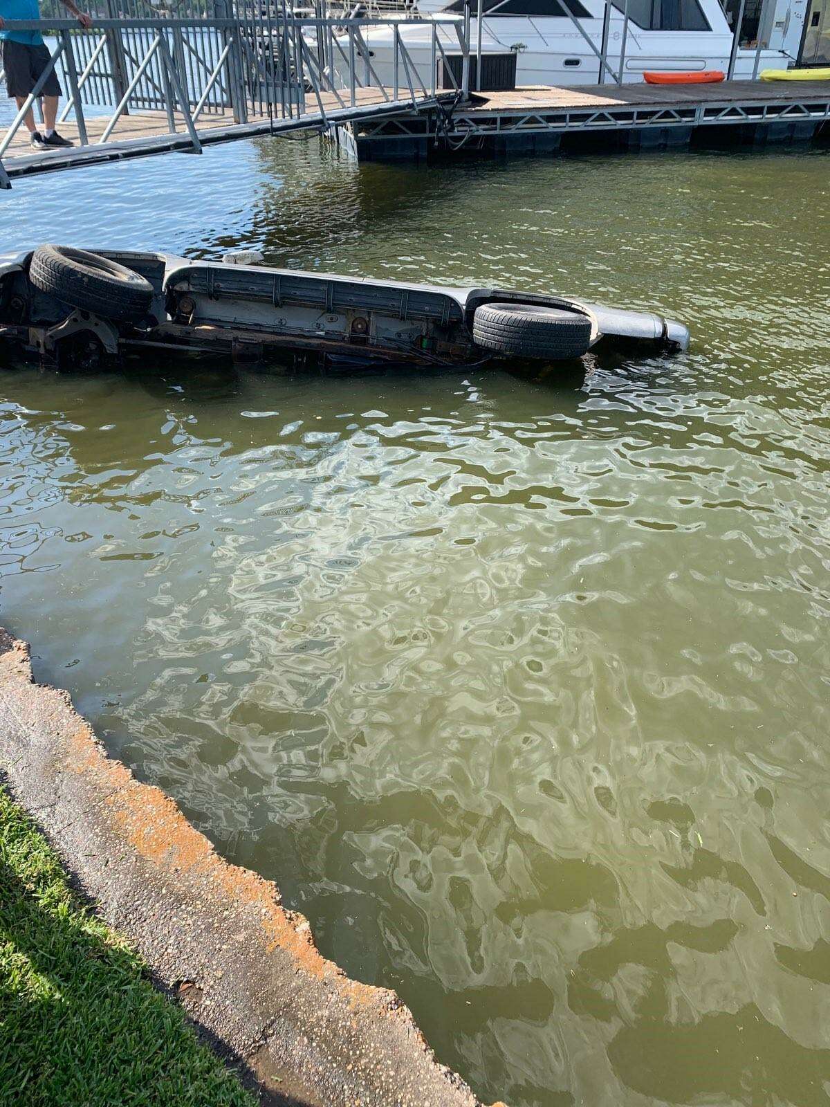 A vehicle rolled Saturday into Lake Conroe in Willis with the driver inside.