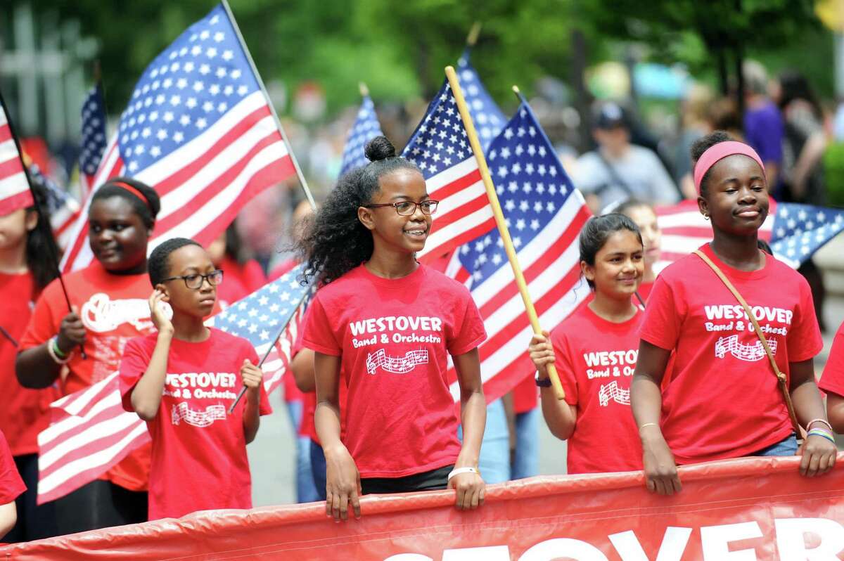 Members of the Westover band and orchestra smile as they lead their group in the annual Memorial Day Parade in Stamford, Conn. on Sunday, May 28, 2017.