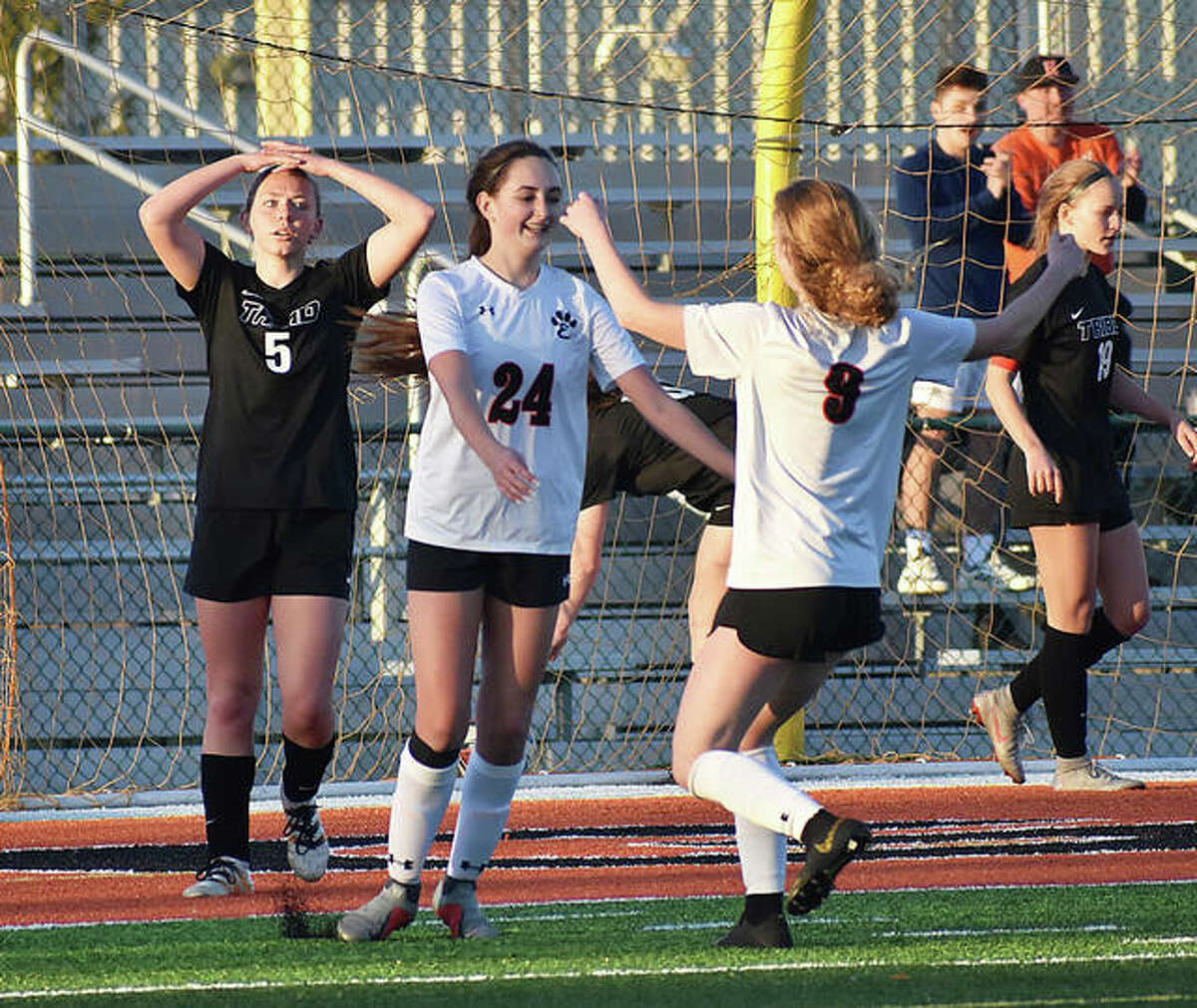 Edwardsville’s Rileigh Kuhns, left, celebrates with Payton Federmann after scoring a goal earlier this season.