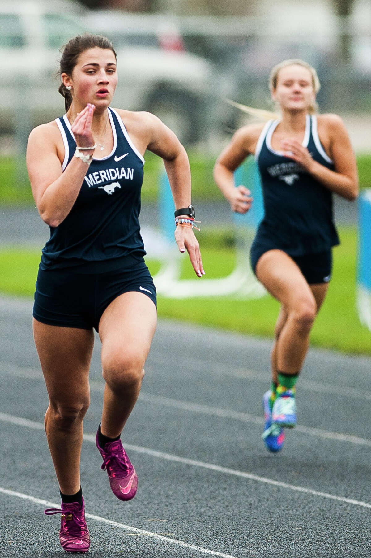 Meridian's Bella Hatfield competes in the 100 meter dash during a meet against Houghton Lake on Monday, May 6, 2019 at Meridian Early College High School. (Katy Kildee/kkildee@mdn.net)