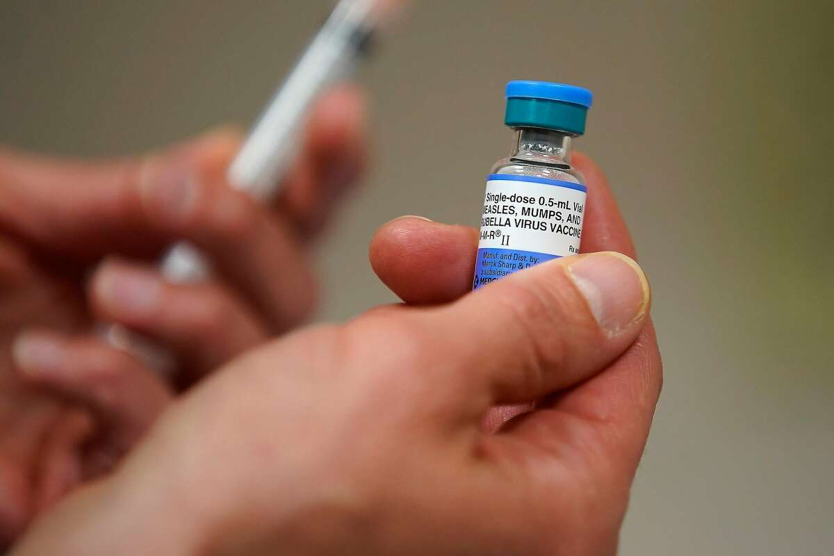 SALT LAKE CITY, UT - APRIL 26: In this photo illustration a one dose bottle of measles, mumps and rubella virus vaccine, made by MERCK, is held up at the Salt Lake County Health Department on April 26, 2019 in Salt Lake City, Utah. (Photo Illustration by George Frey/Getty Images)