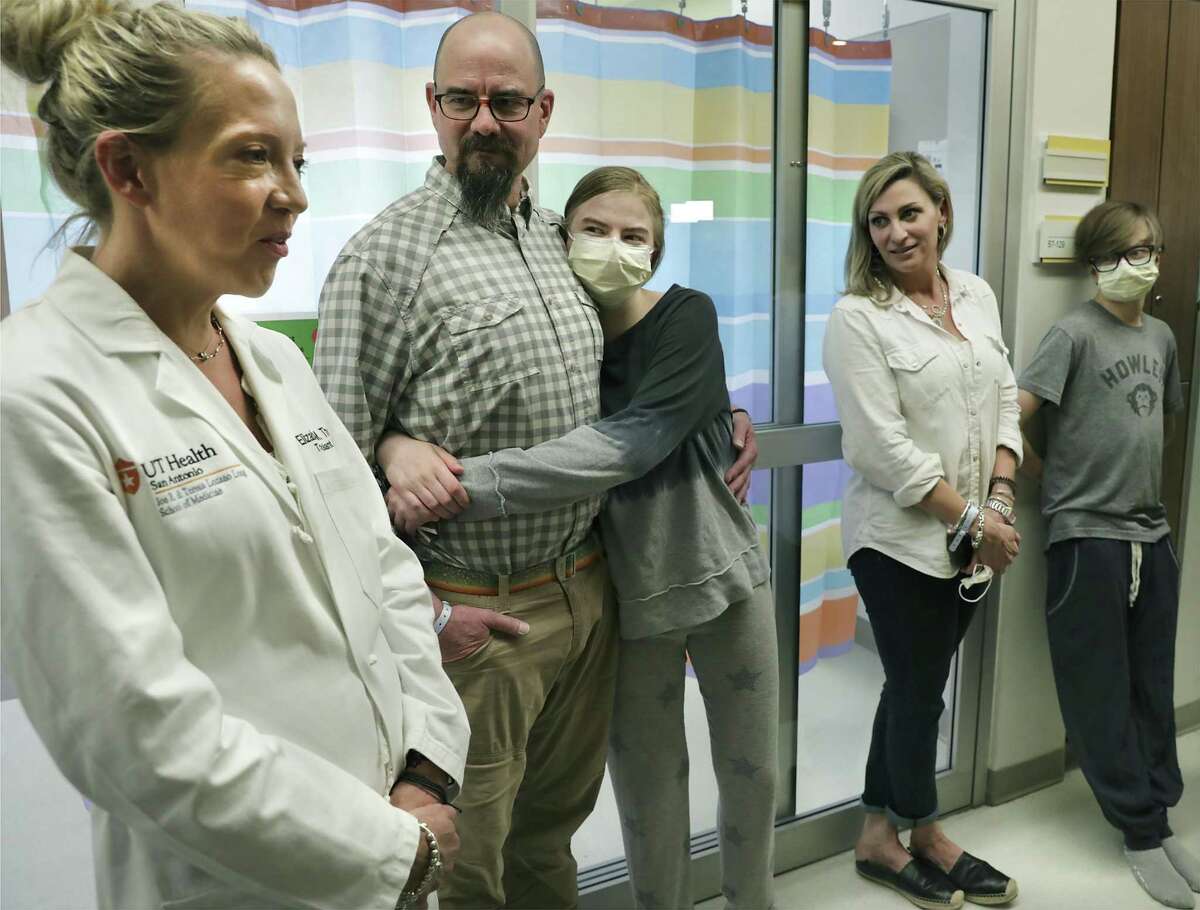 Dr. Elizabeth Thomas, left, associate professor of surgery at University Transplant Center, talks about the unusual double kidney transplant that gave one organ to Ava Shepperd, 14, hugging her father John Shepperd, and the other to her brother John Ben Shepperd, far right, next to his mother Kim Azar Shepperd. The brother and sister both have a genetic disorder that compromised their kidneys. The kidneys came from one deceased donor. The transplants took place at University Transplant Center on May 3, 2019.