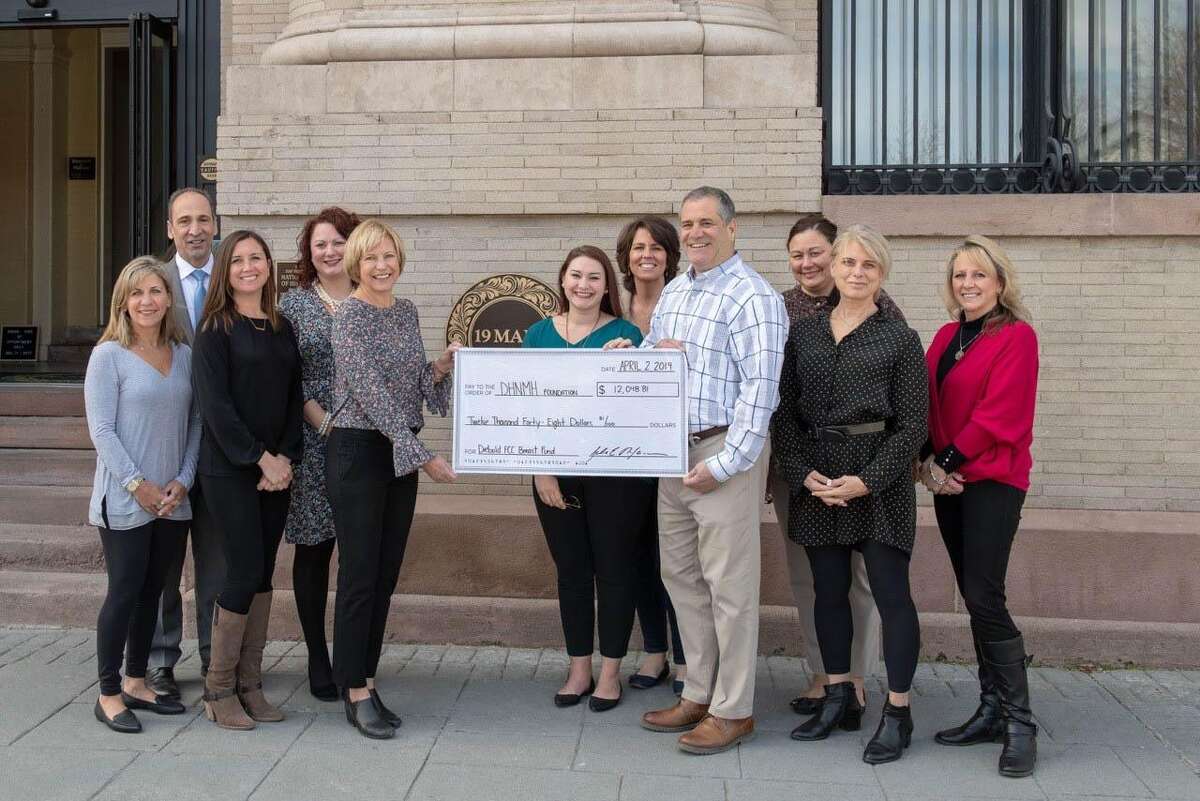 A check for $12,000 was recently presented to New Milford Hospital to support its Breast Health Fund at the Diebold Cancer Center. With the help of the leading committee from 19 Main, Joe's Salon and Western Connecticut Health Network, which operates the hospital, more than $12,000 was raised at the third annual Wicked Wine Evening held at the 19 Main venue in town last fall. The event was hosted by NeJaime's Wine and Spirits in New Milford. More than 200 individuals attended the event, and 30 vendors participated. Wine, beer and spirits were served. This year's event featured platinum sponsors Nicholas Tobin Insurance, Structured Homes, Bakewell and Mulhare, Matson Financial, Webster Bank and RC3 Electric, gold sponsors Cramer and Anderson, UBS and Omaha Beef, and silver sponsors Hudson Valley Preservation, Mind Body Connect and Source Construction. The next Wicked Wine event will be held Nov. 1. Above are, from left to right, on the left side of the check, in front, Jody NeJaime, Meredith Cleary, president of Bank Street Group and Cindy Tyler, NMH breast care navigator and, in back, Dr. Thomas Koobatian, chief of staff at New Milford Hospital and Tracey Sheedy, and, on the right side of the check, in front, Kylie Costello, 19 Main event coordinator, John NeJaime, owner of NeJaime's Wine and Spirits, Karen Ross, owner of Joe's Salon and Becky Mulhare, and, in back, Nancy Meyer and Adele Oconnor of the WCHN Foundation.