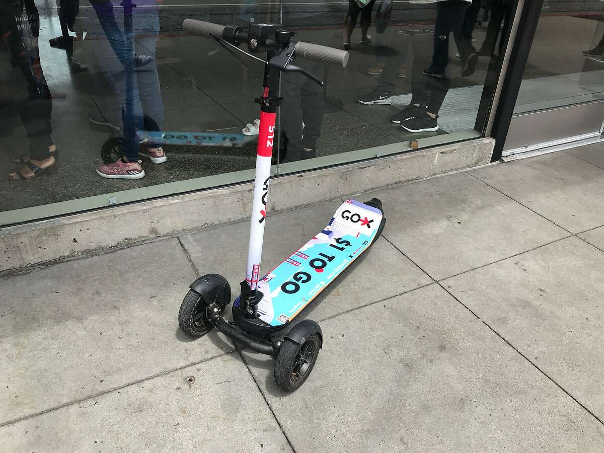 A three-wheeled Go X scooter on the sidewalk in San Francisco's Fisherman's Wharf on Sunday, May 5, 2019. Go X CEO Alex Debelov says such appearances should be rare, since the company charges users a fee when they don't return scooters to designated locations.