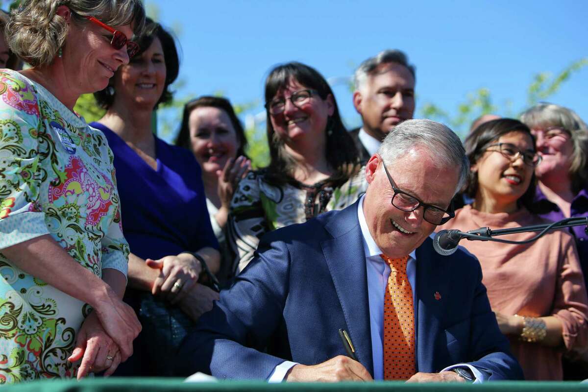 Washington State Governor and presidental candidate Jay Inslee signs five climate change bills into law that will reduce carbon emissions, decrease pollution, boost jobs and increase public health, Tuesday, May 7, 2019, at Central Park in the Rainier Vista neighborhood. The bills include SB 5116, HB 1112, HB 1257, HB 1444, HB 2042.