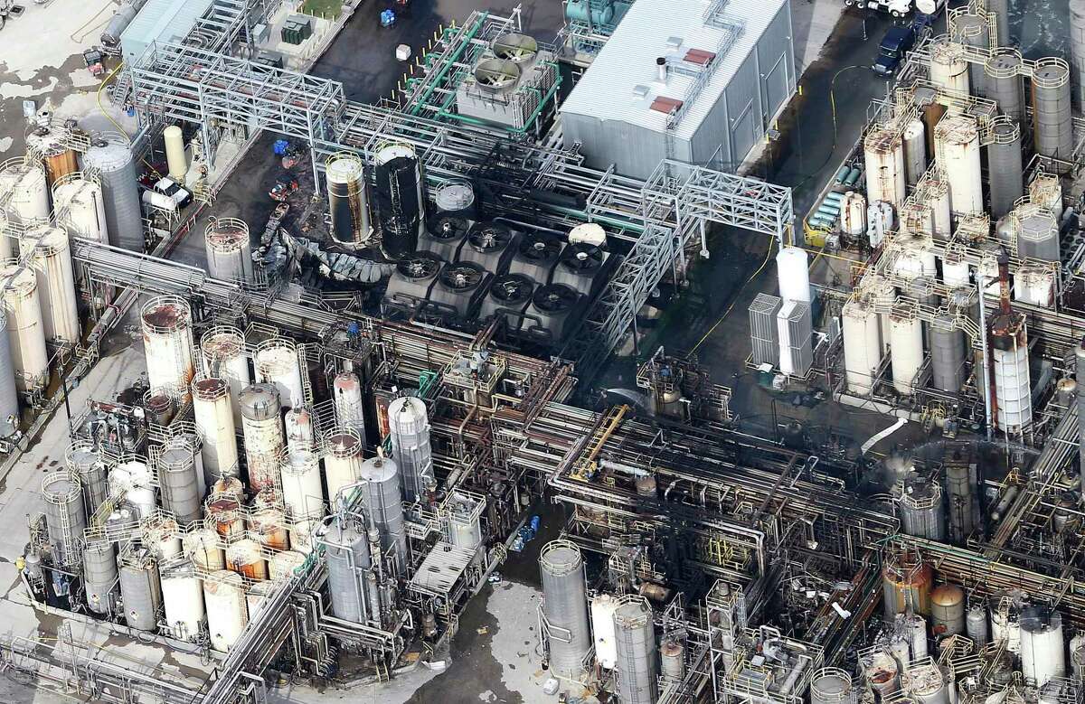 This aerial photo shows the KMCO chemical plant as firefighters spray water on a fire on Tuesday, April 2, 2019, in Crosby, Texas.
