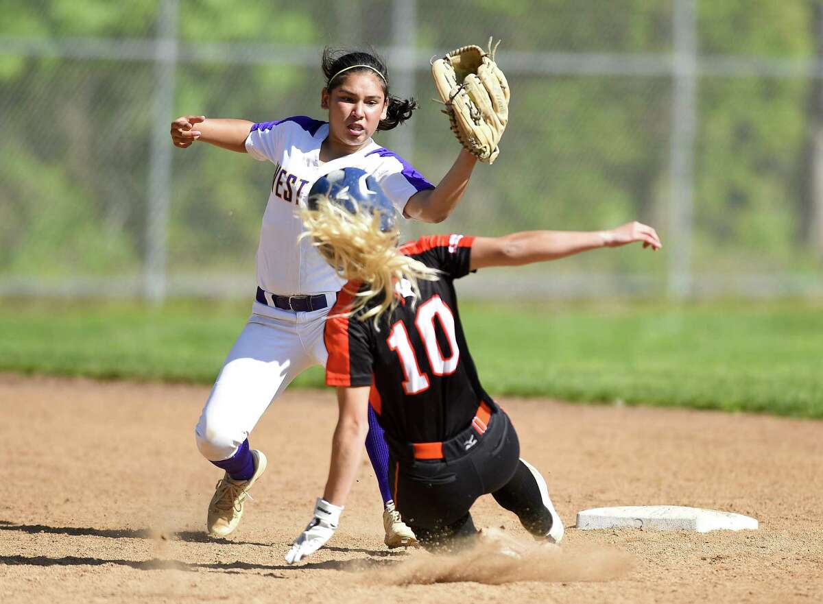 Westhill's Madelyn Bautista (1) tags out Stamford's Brycelin Stalteri (10) on a second inning steal in a girls softball game at Westhill High School on May 8, 2019 in Stamford, Connecticut. Stamford defeated Westhill 6-4 in eight innings.