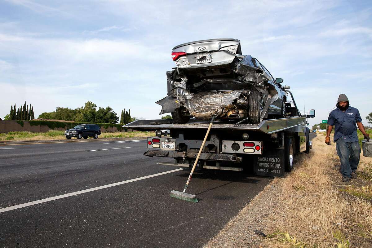 One of the cars involved in a fatal car crash on eastbound Highway 12 just west of Beck Avenue sits on the flat bed of a tow truck in Fairfield, Calif. on Wednesday, May 8, 2019.