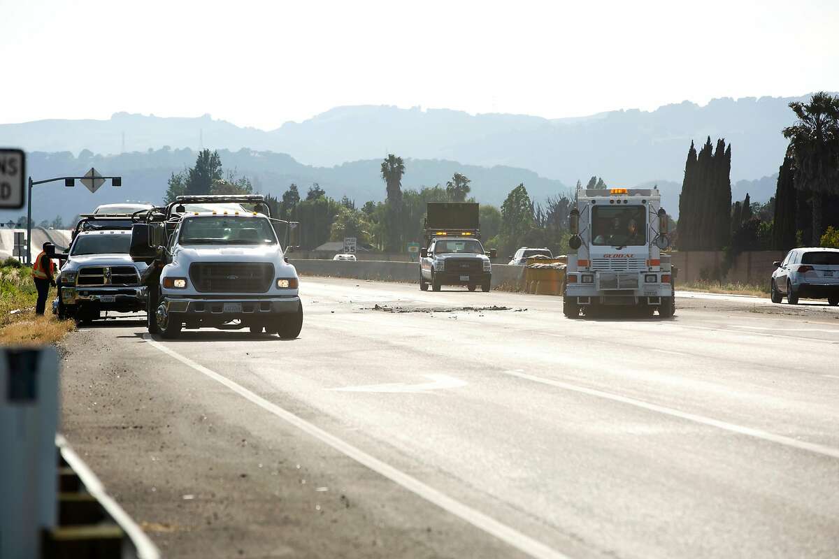 Crews work to clear the debris and glass from the site of a fatal car crash on eastbound Highway 12 just west of Beck Avenue in Fairfield, Calif. on Wednesday, May 8, 2019.