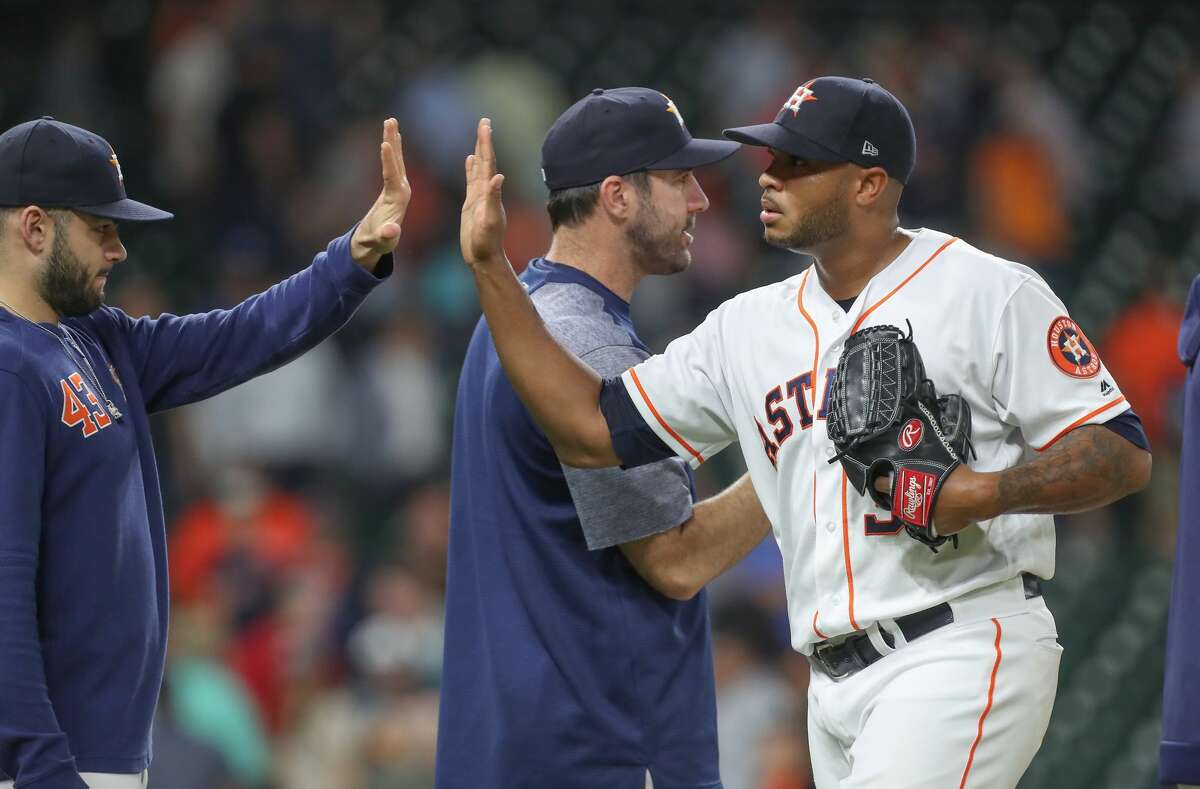 Houston Astros relief pitcher Josh James (39) receives cogrtatulations after making the final out during the an MLB baseball game at Minute Maid Park Wednesday, May 8, 2019, in Houston.