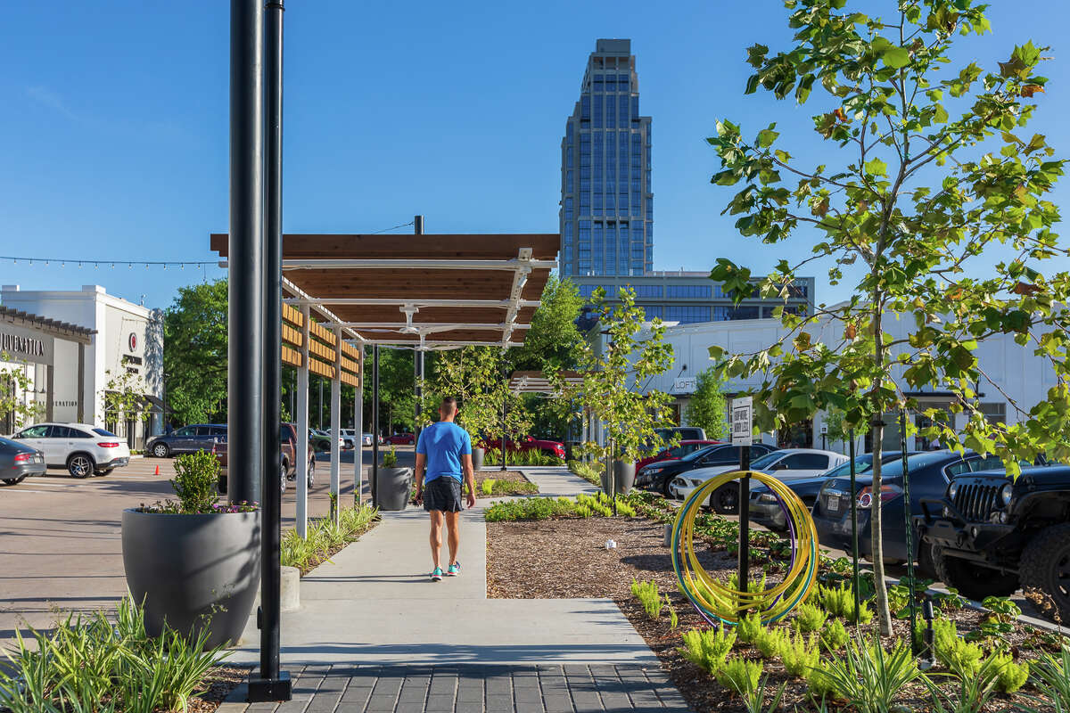 New trellises and sidewalks are part of renovations at Uptown Park that were designed to create more connected spaces and gathering areas for visitors to the development's shops and restaurants.