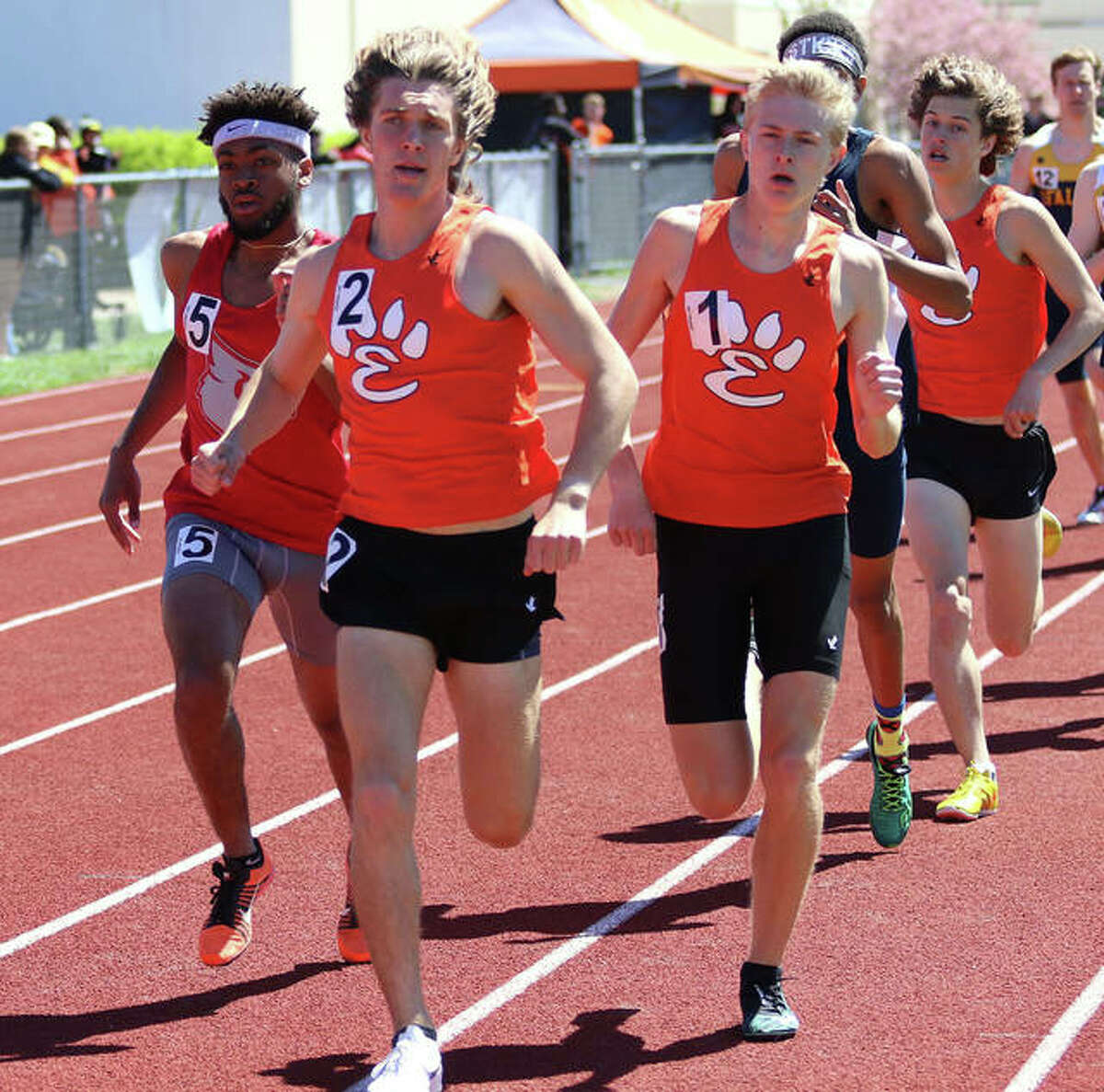 Alton’s Cassius Havis (left) runs outside Edwardsville’s Roland Prenzler (front) and Jack Pifer on the lead in the 1,600-meter run at the Winston Brown Invite on April 20 in Edwardsville. On Wednesday at the SWC Meet in Collinsville, Havis won the 800 meters and Prenzler was a double-winner in the 1,600 and 3,200.