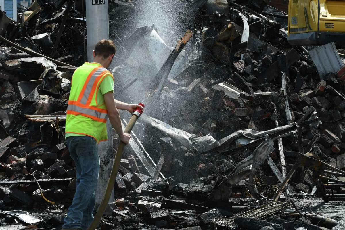 Alpha Lanes bowling alley is reduced to a pile of rubble following Wednesday's fire on Thursday, May 9, 2019, in Troy, N.Y. (Will Waldron/Times Union)
