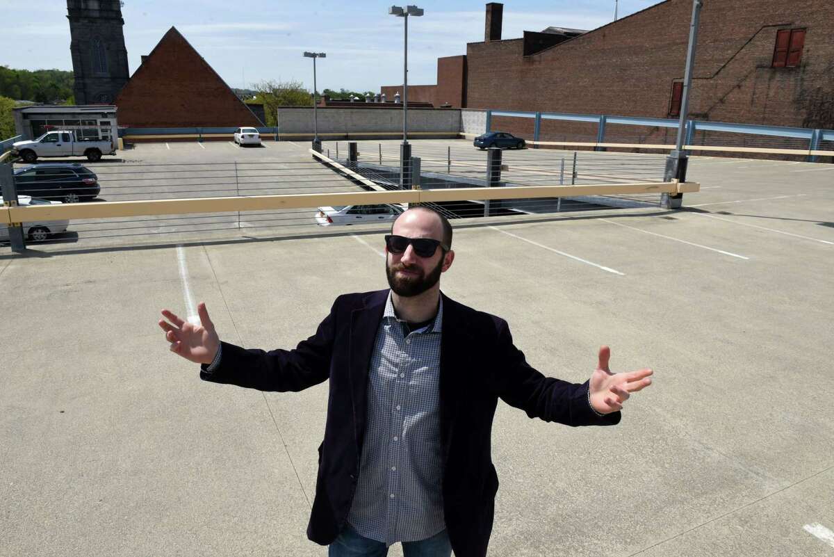 Zack Cohen stands on the top floor of the city-owned 5th Ave. Parking Garage on Thursday, May 9, 2019, in Troy, N.Y. Cohen is fighting back against Troy's downtown parking rules that he says, don't take residents into account. (Will Waldron/Times Union)