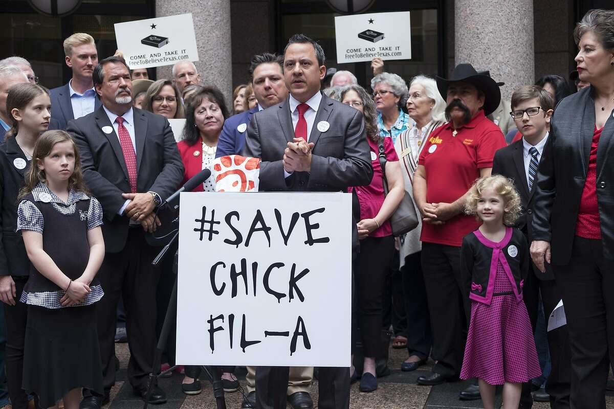 Jonathan Saenz, president of Texas Values, leads a press conference for Save Chick-fil-A Day for religious freedom in the central court outdoor rotunda at the Texas State Capitol. [Dimitri Staszewski/San Antonio Express-News]