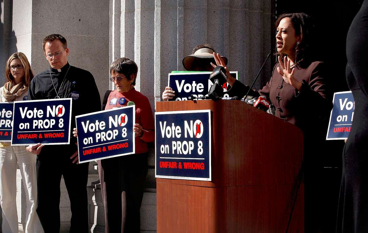 San Francisco District Attorney Kamela Harris speaks during a rally on the steps of City Hall in Oakland, Calif. on Tuesday Oct. 21, 2008, in supporting the defeat of Proposition 8 on the November ballot. Supporters at left are, Darcy Collins, Rev. Michael Schuenemeyer and Mary Strauss.