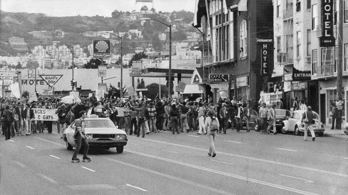 A protest march in reaction to the Dan White manslaughter verdict moves down Upper Market Street, May 21, 1979, P. B