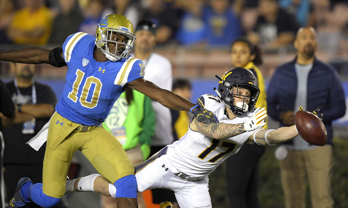 California wide receiver Vic Wharton III, right, can't reach a pass intended for him while under pressure from UCLA defensive back Colin Samuel during the first half of an NCAA college football game, Friday, Nov. 24, 2017, in Los Angeles. (AP Photo/Mark J. Terrill)