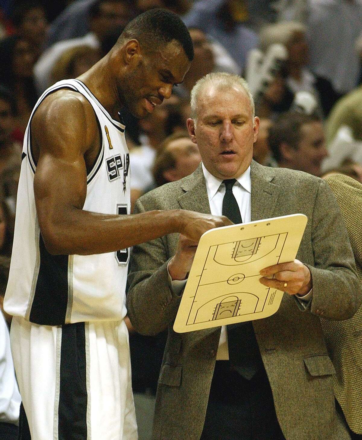 Spurs Coach Gregg Popovich and David Robinson confer during the fourth quarter of game two of the NBA Finals at the SBC Center on Friday, June 6, 2003. ( JERRY LARA STAFF )