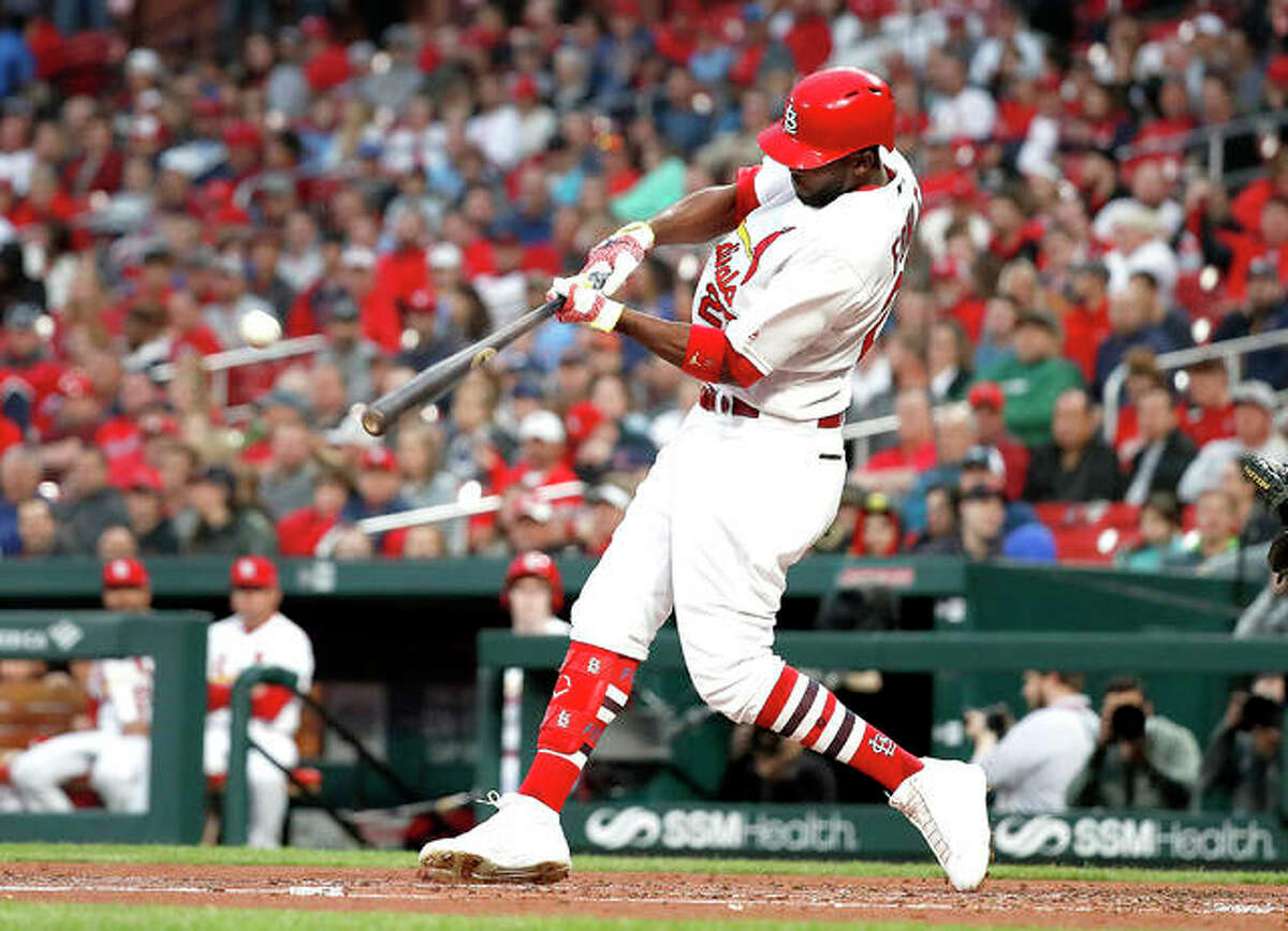 The Cardinals’ Dexter Fowler hits a ground-rule double to score two runs in the second inning of Monday night’s victory over the Pittsburgh Pirates at Busch Stadium.