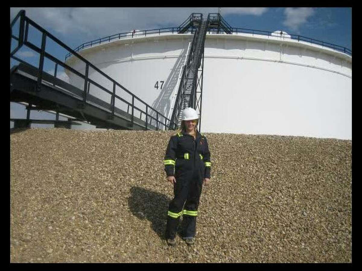 Marnie Yohemas, shown early in her career in front of Enbridge's tank farm. Yohemas grew up in the pipeline industry at her family’s mid-size oil and gas pipeline business in Canada.