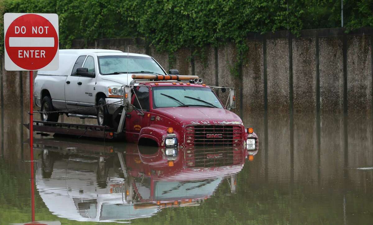 A truck stuck in the flooded intersection of Hardy and Crosstimbers streets after heavy rainfall overnight Friday, May 10, 2019, in Houston.