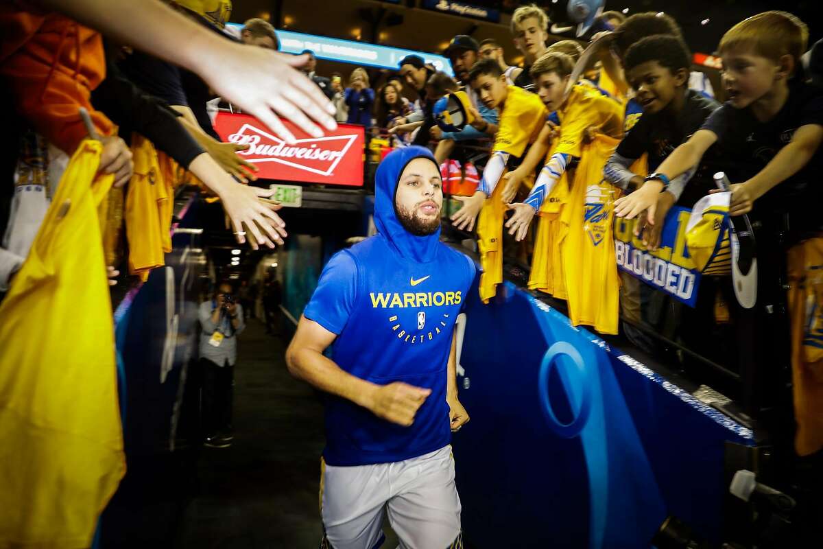 Stephen Curry runs through the tunnel to warm up ahead of Game 5 of the Western Conference Semifinals between the Golden State Warriors and the Houston Rockets at Oracle Arena in Oakland, California, on Wednesday, May 8, 2019.
