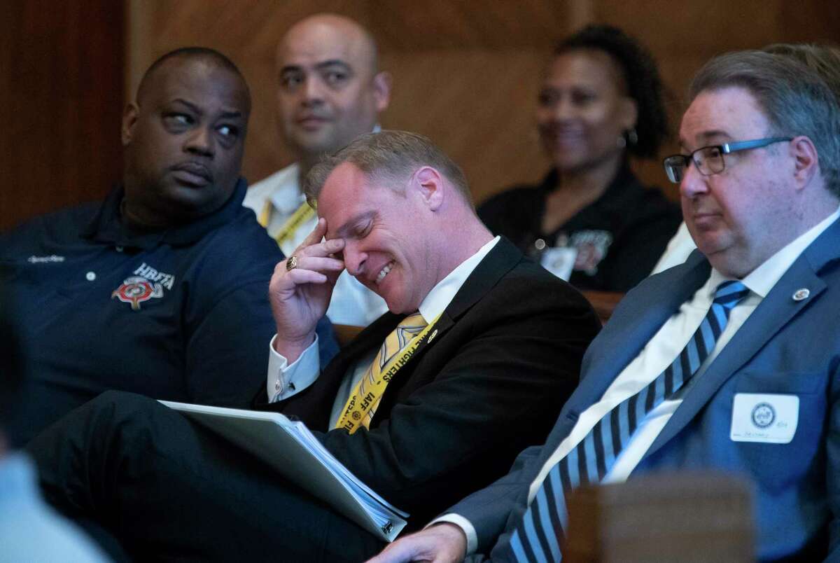 Houston Professional Fire Fighters Association President Marty Lancton reacts during a meeting of the Houston City Council ethics panel while HFD chief Sam Pena spoke about a plan to demote firefighters at City Hall in Houston, Monday, April 29, 2019.