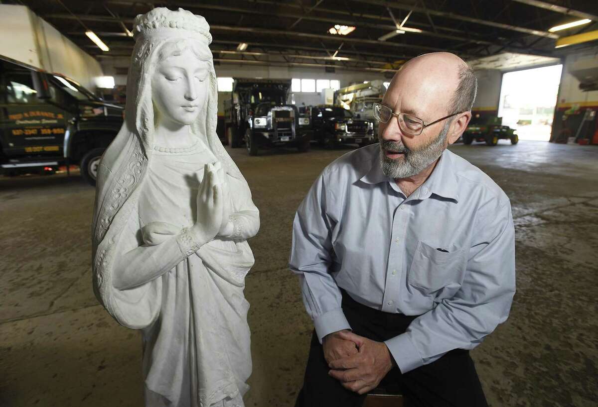 Jeffrey Damberg of Greenwich, a local sculptor and fine artist talks about the restoration work he did on a statue of Mary at the landscaping facilities of Fred Durante Jr on May 8, 2019 in Stamford, Connecticut. A crew from Durante's landscaping company dug up the figurine in Riverside. For the past several months, Damberg has spent countless hours restoring the statue, which will be unveiled on Mother's Day at St. Catherine of Siena in Riverside.