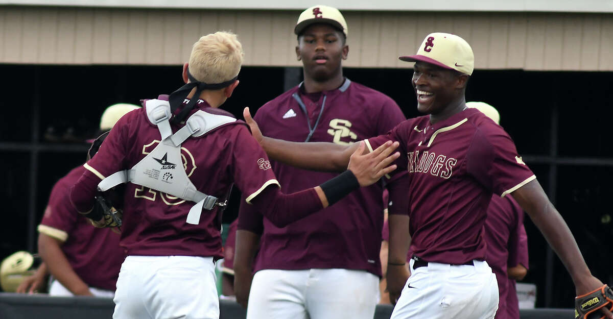 Summer Creek senior pitcher Andre Duplantier II, right, celebrates with his senior catcher Jake Cantu, center, after the final out against Clear Springs in the top of the 7th inning of Game One of their Region II-6A Area Baseball Playoff series at Humble High School on May 10, 2019.