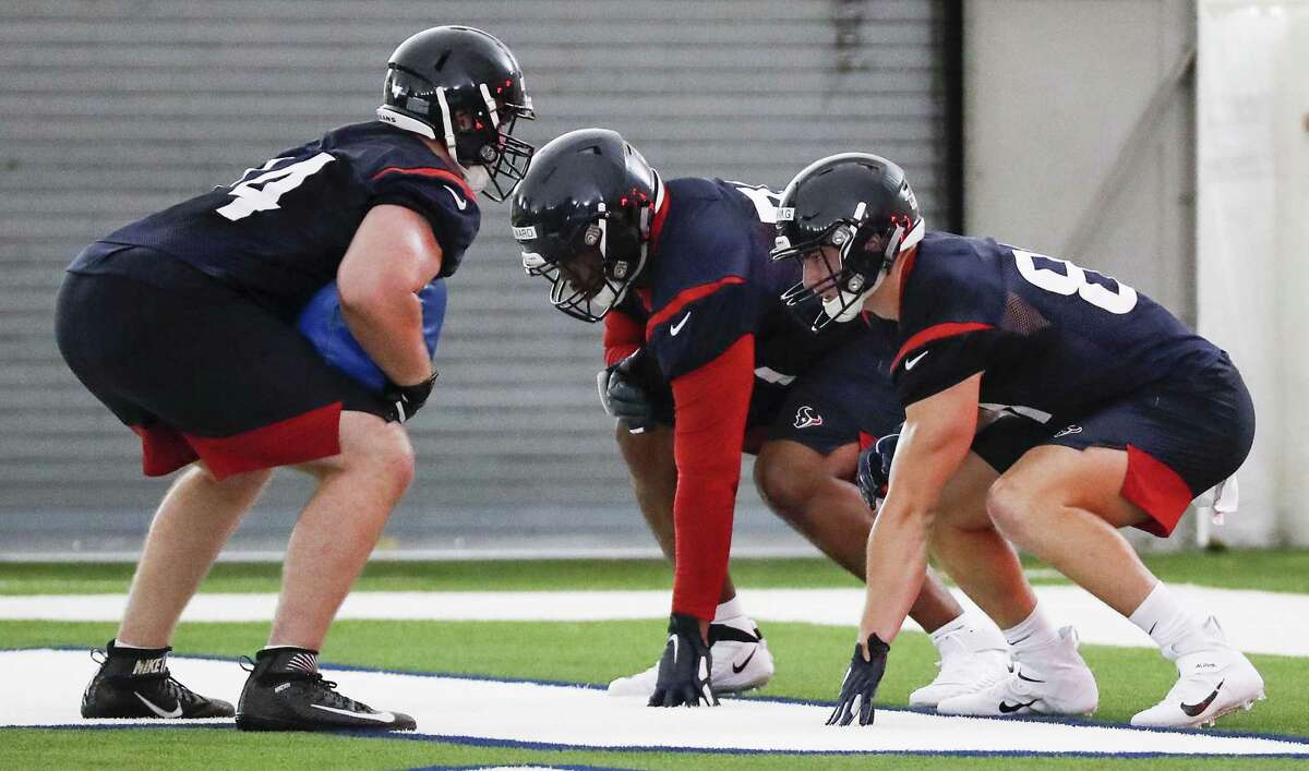 Houston Texans tackle Max Scharping (74), tackle Tytus Howard (71) and tight end Kahale Warring (81) line up to run a blocking drill during rookie mini camp at The Methodist Training Center on Friday, May 10, 2019, in Houston.