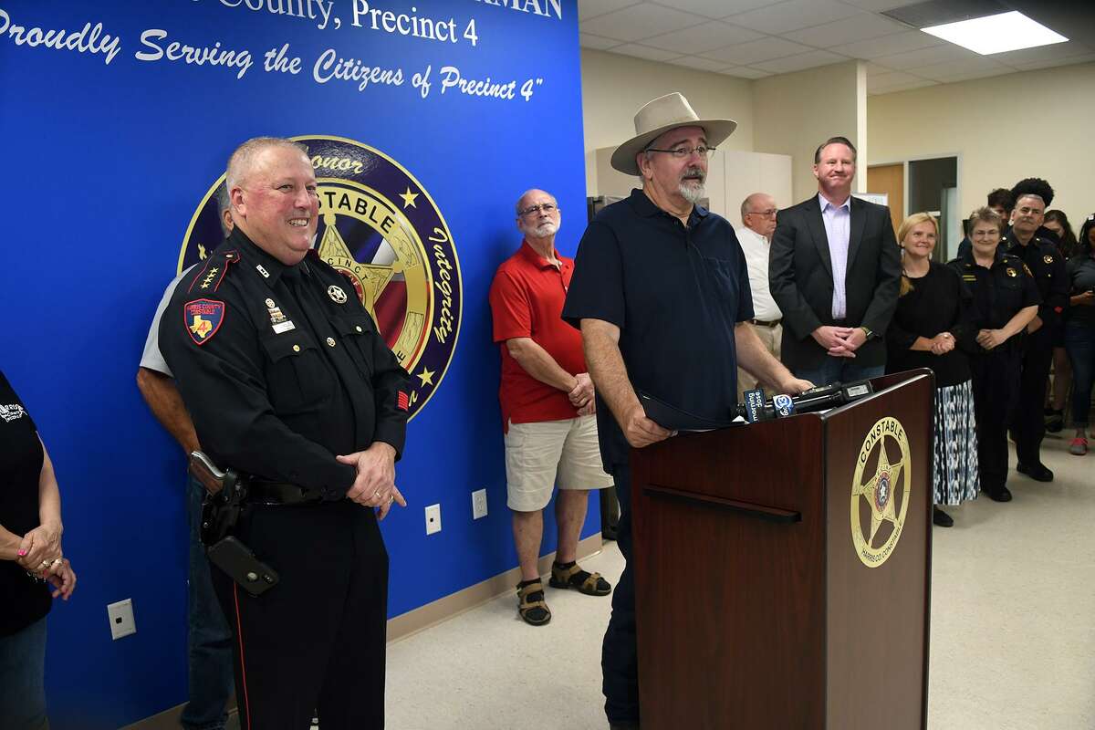 Harris County Precinct 4 Constable Mark Herman, from left, and Commissioner Jack Cagle lead the ribbon cutting for the new Pct. 4 substation in Spring on May 10, 2019.