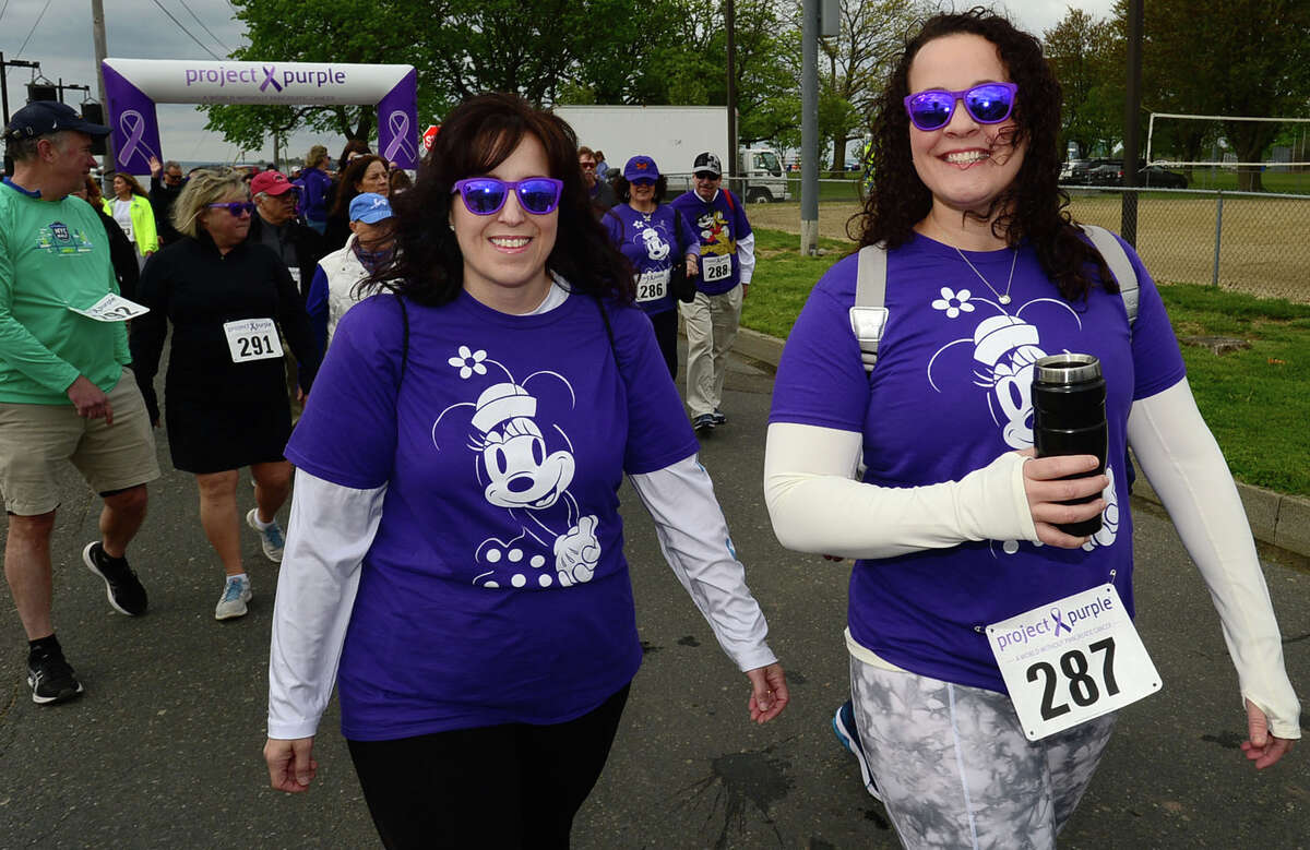 Norwalk residents Lauren Volpe and Lisa Nekrich participate in The Project Purple Steps for a Cure run and walk to benefit Pancreatic Cancer research Saturday, May 11, 2019, at Calf Pasture Beach in Norwalk, Conn. The event is in memory of lifelong Norwalk resident Donna Cutrone and all those battling pancreatic cancer.