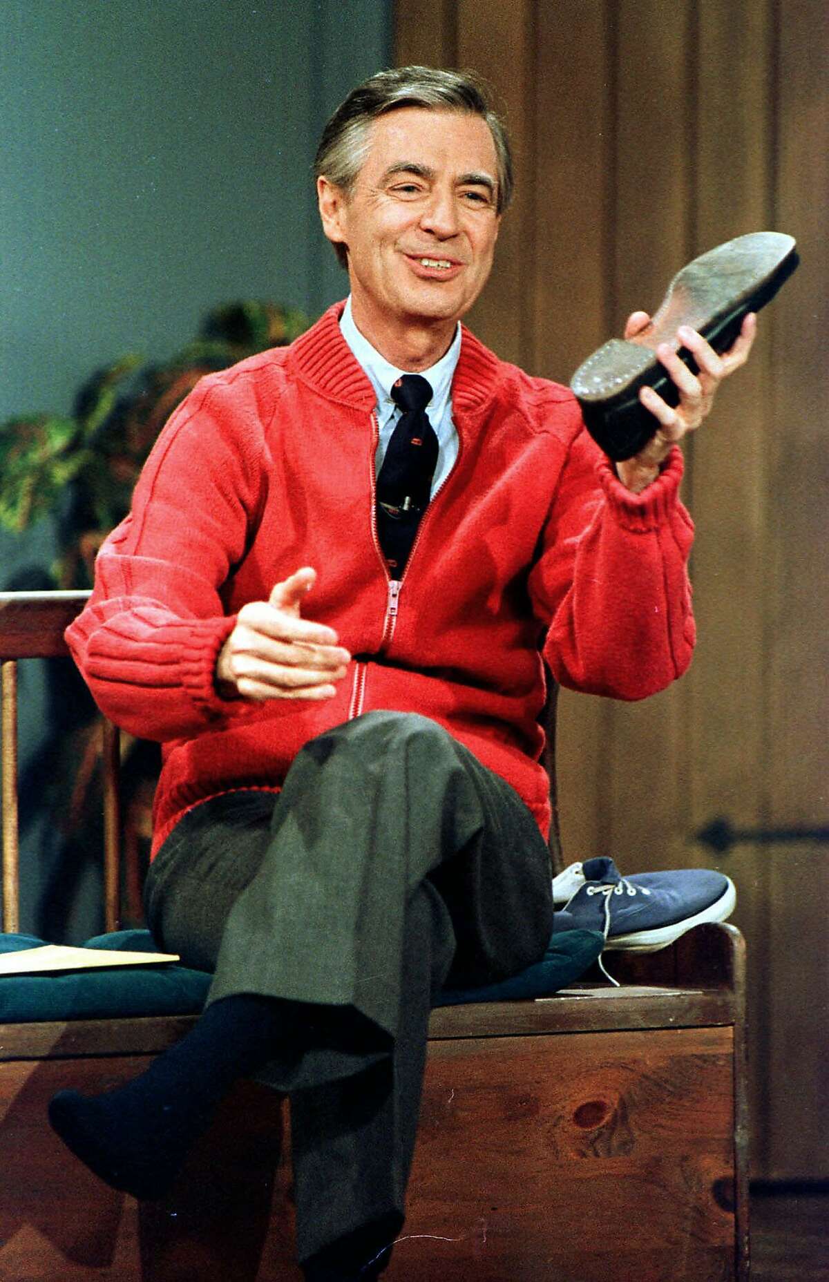 FILE - This June 28, 1989 file photo shows Fred Rogers as he rehearses the opening of his PBS show "Mister Rogers' Neighborhood" during a taping in Pittsburgh. Pennsylvania Gov. Tom Wolf said on Friday, May 10, 2019, that Pennsylvanians will be encouraged to exhibit acts of kindness later this month in honor of the beloved PBS children's show host.
