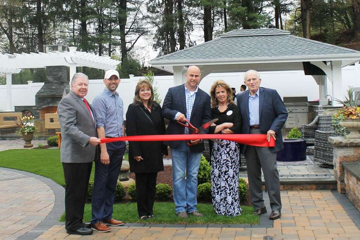 Torrison Stone & Garden at 422 Main St., Durham, held a ribbon cutting for its new outdoor showroom April 26. From left are Middlesex County Chamber of Commerce Chairman Jay Polke, Torrison Landscape Architect & Managing Partner Brian Murphy, First Selectman Laura Francis, Torrison Owner Tyler Gerry, Business Manager Suzanne Ciofalo and Chamber President Larry McHugh.