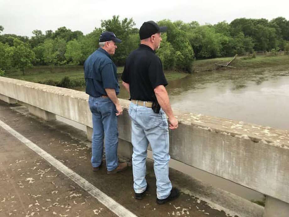 Commissioner Vincent Morales, Constable Mike Beard and Mayor-Elect Andrew Bohac surveyed the damage and high water levels on Saturday, May 11, in the hardest hit parts of Needville. Photo: Fort Bend County Constable Precinct 1