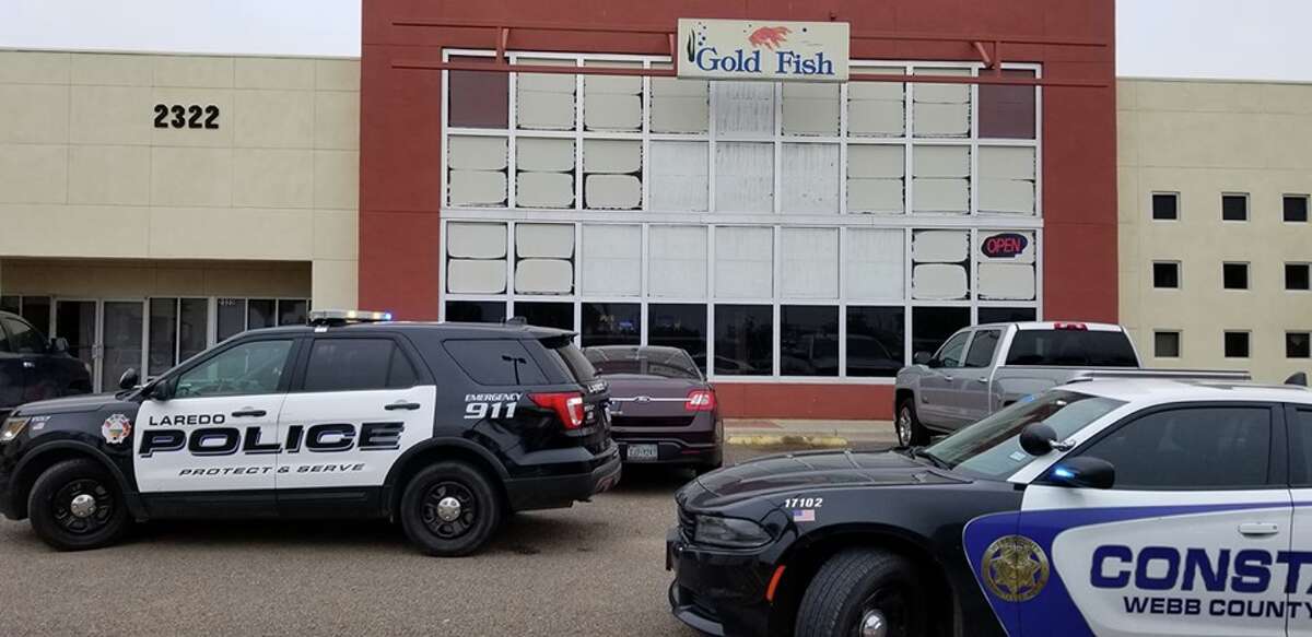Law enforcement could be seen outside the Gold Fish on Jacaman Road. The Gold Fish is one of five locations raided on Friday afternoon as part of Operation One-Armed Bandit.