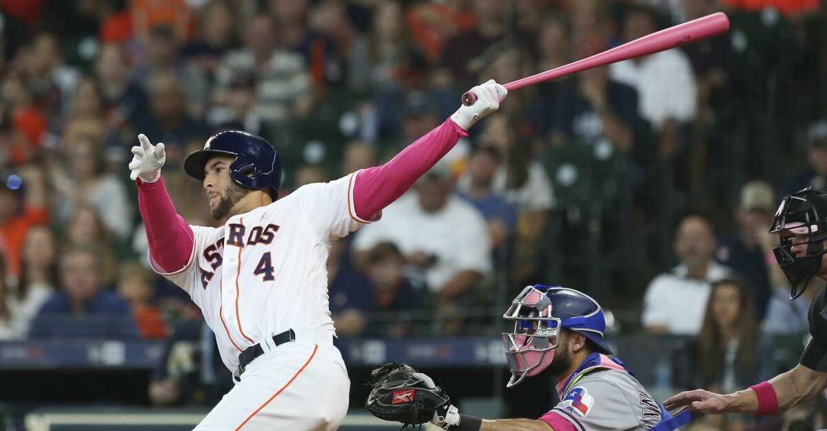 Houston Astros center fielder George Springer (4) swings during the bottom second inning against the Texas Rangers at Minute Maid Park on Sunday, May 12, 2019, in Houston.