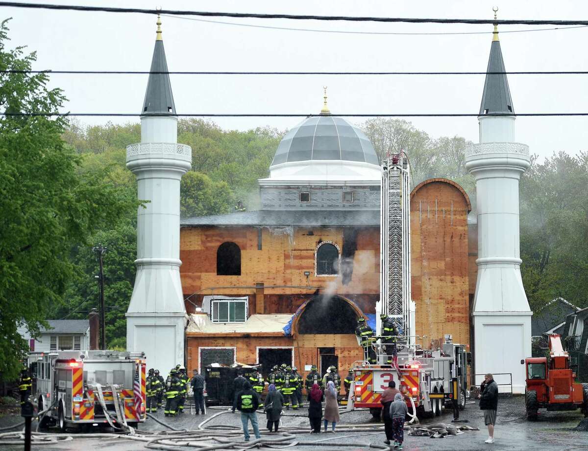New Haven firefighters respond to a fire at the Diyanet Mosque of New Haven on Middletown Avenue on May 12, 2019.
