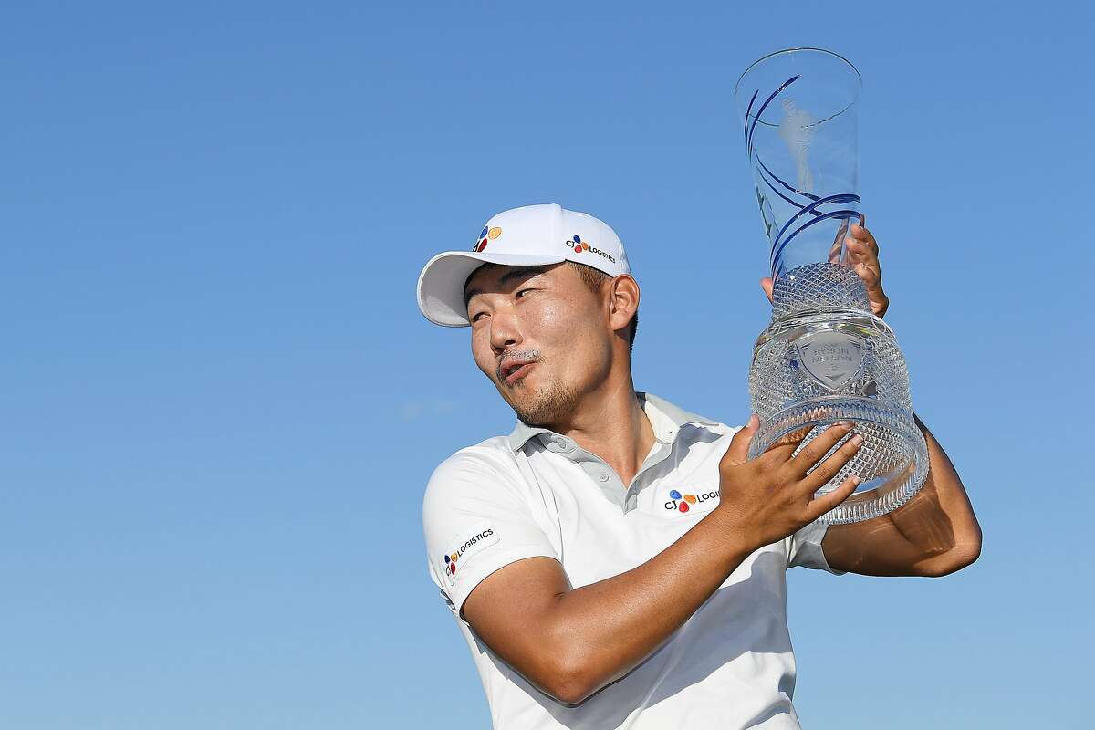 DALLAS, TEXAS - MAY 12: Sung Kang of Korea poses for a photo with the trophy after winning the AT&T Byron Nelson at Trinity Forest Golf Club on May 12, 2019 in Dallas, Texas. (Photo by Stuart Franklin/Getty Images)
