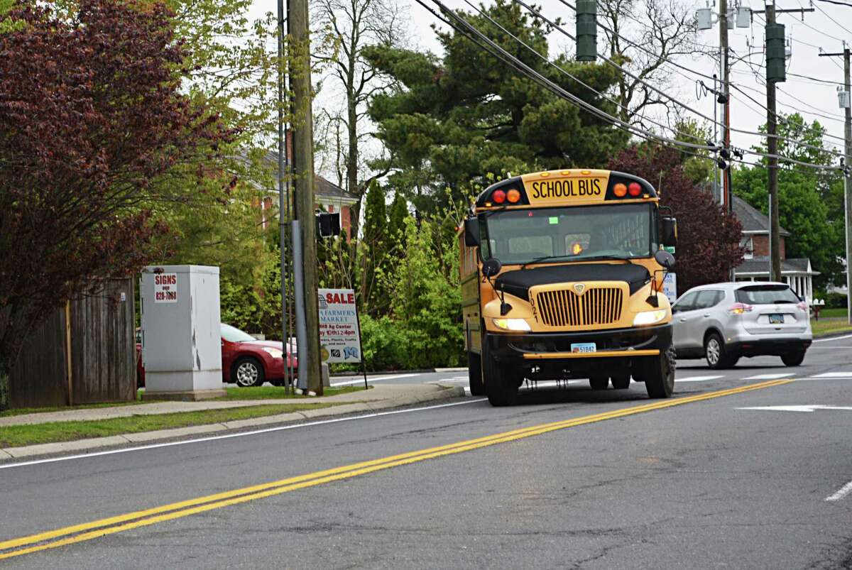 A bus leaves the high school after dropping off students Monday morning on La Rosa Lane in Middletown.