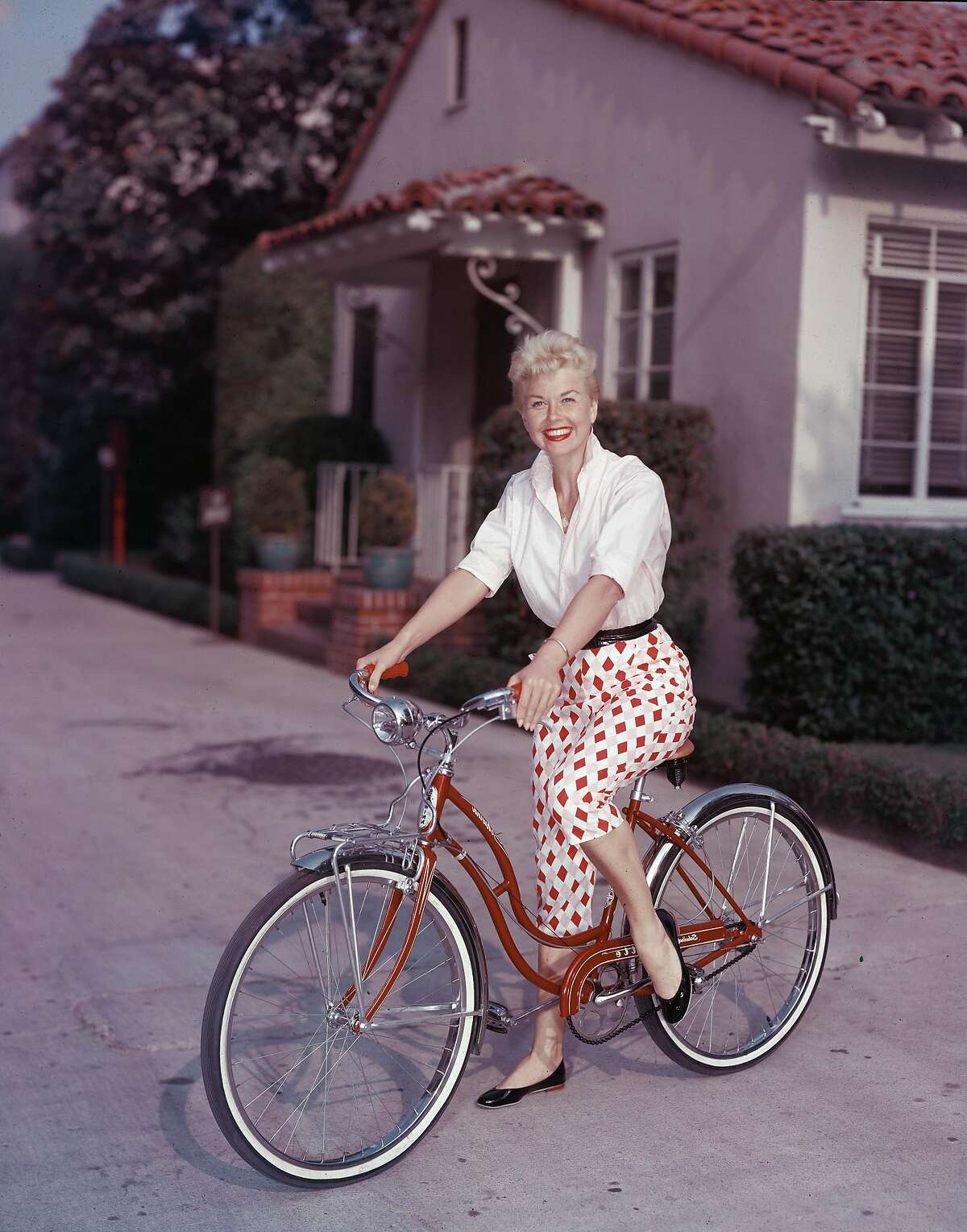 it has been announced that actress Doris Day has died at the age of 97 on May 13, 2019. American actor Doris Day poses on a red Schwinn bicycle, late 1950s. (Photo by Hulton Archive/Getty Images)