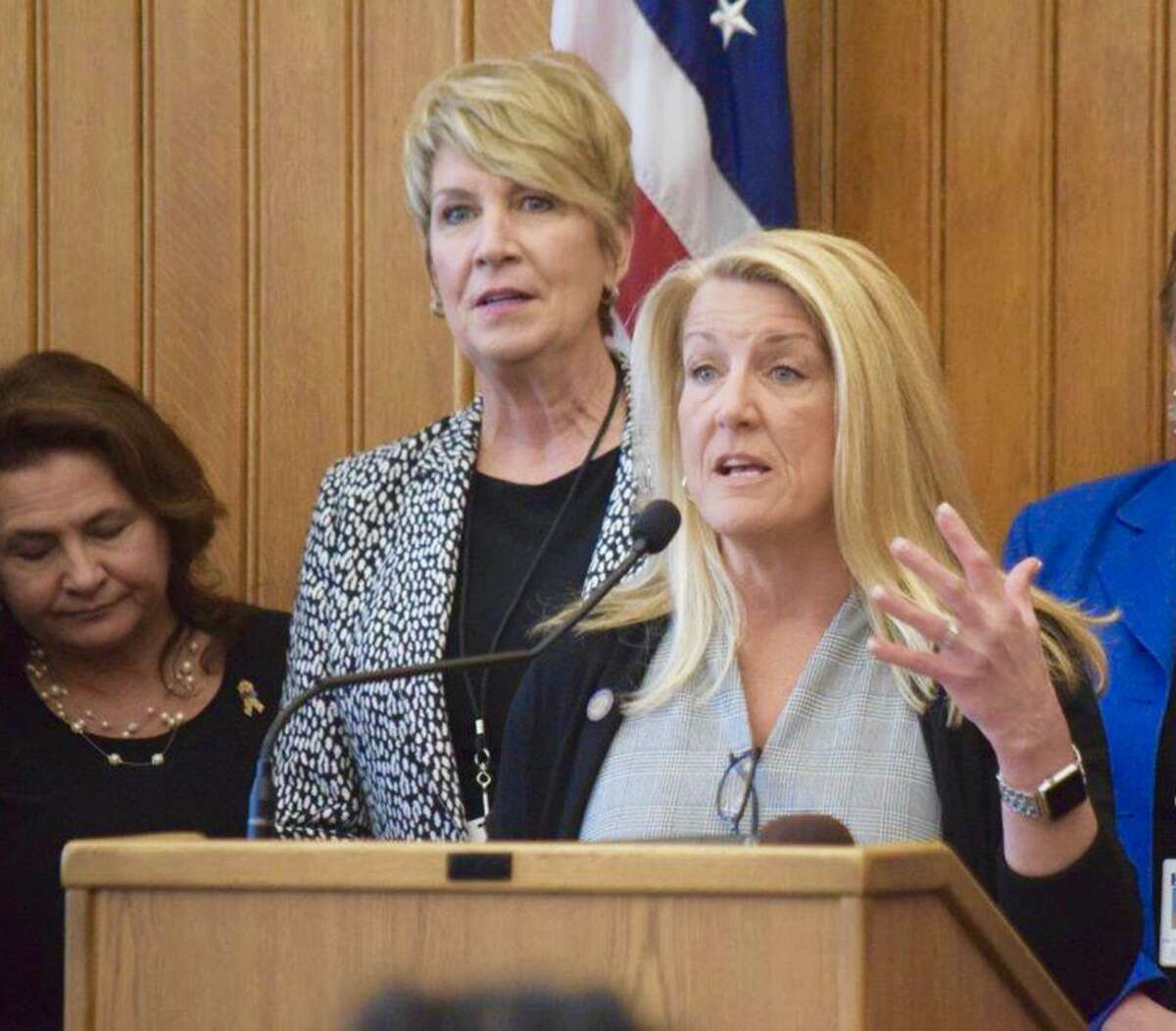 State Rep. Brenda Kupchick, at podium, with State Rep. Laura Devlin at the State Capital.