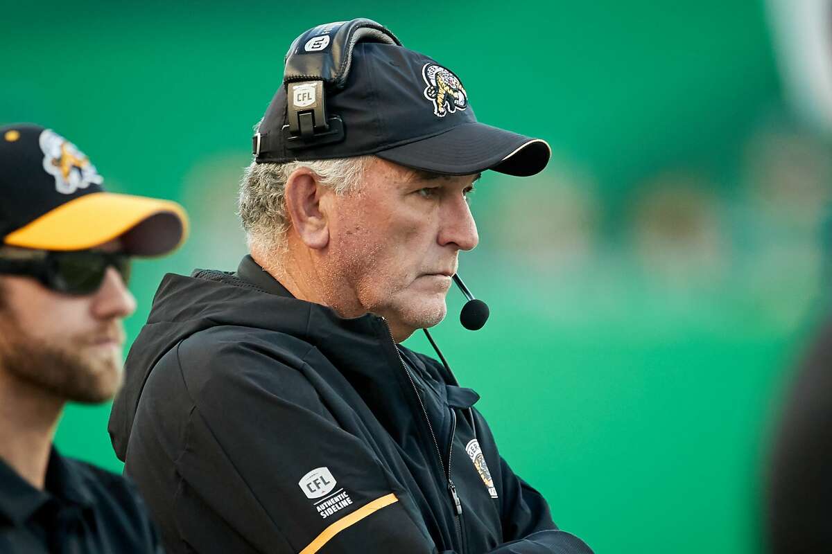 PHOTOS: June Jones through the years REGINA, SK - JULY 05: Head coach June Jones of the Hamilton Tiger-Cats on the sideline during the game between the Hamilton Tiger-Cats and Saskatchewan Roughriders at Mosaic Stadium on July 5, 2018 in Regina, Canada. (Photo by Brent Just/Getty Images)