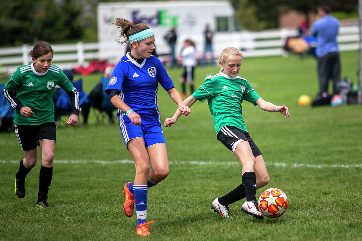 Midland Fusion 06's Sydney Lambert moves the ball down the field during their game against La Forza 06 Blue during the 37th annual Midland Invitational Tournament at the Midland Soccer Club in Midland on Saturday, May 11, 2019. (Josie Norris/for the Daily News)