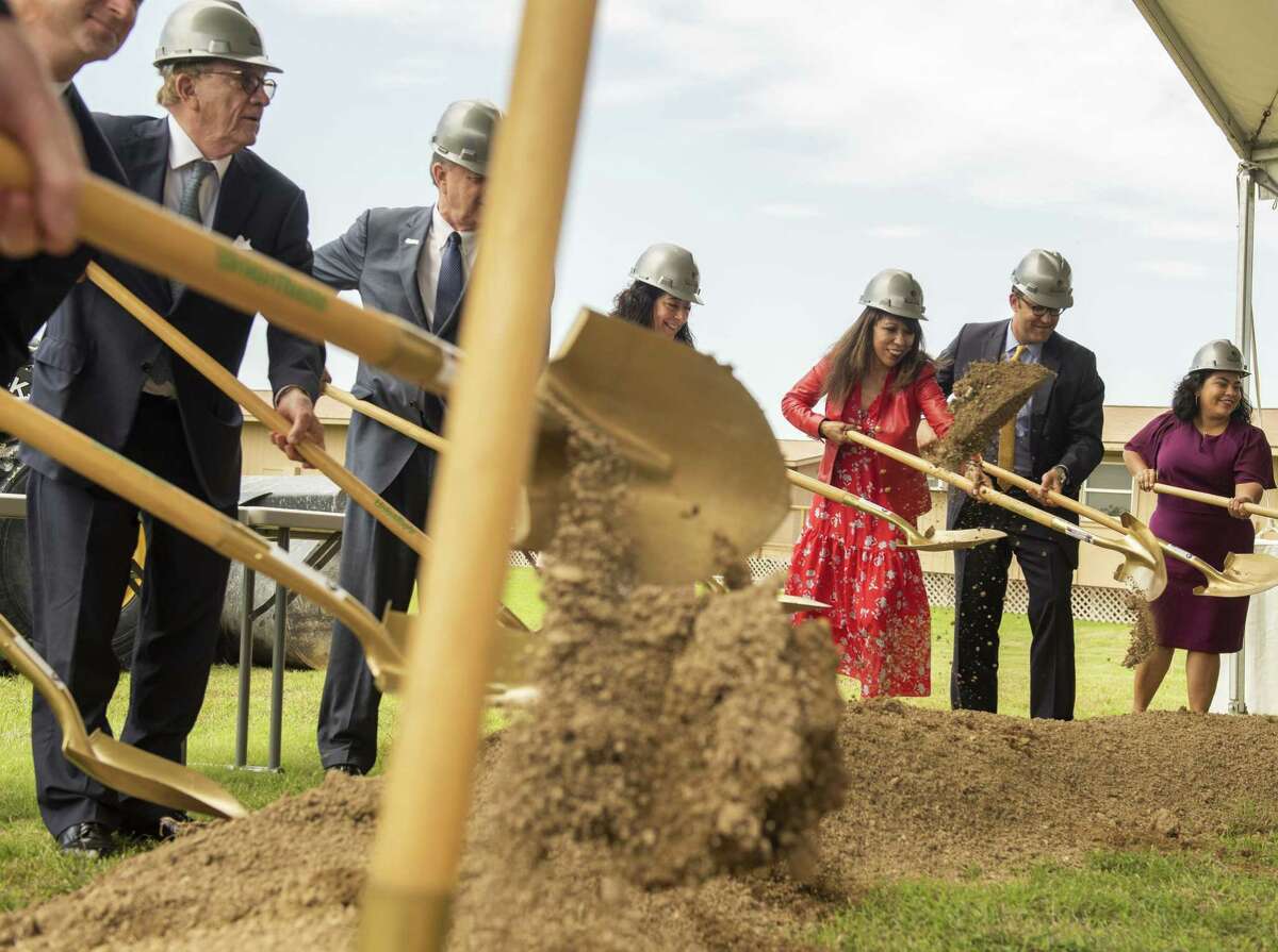 Texas A&M University-San Antonio President Cynthia Teniente-Matson, (red dress), Vice Chair of the Texas A&M Board of Regents Elaine Mendoza, left, U.S. Rep. Will Hurd and councilwoman Rebecca Viagran break ground on the school’s new academic and administration building this month.