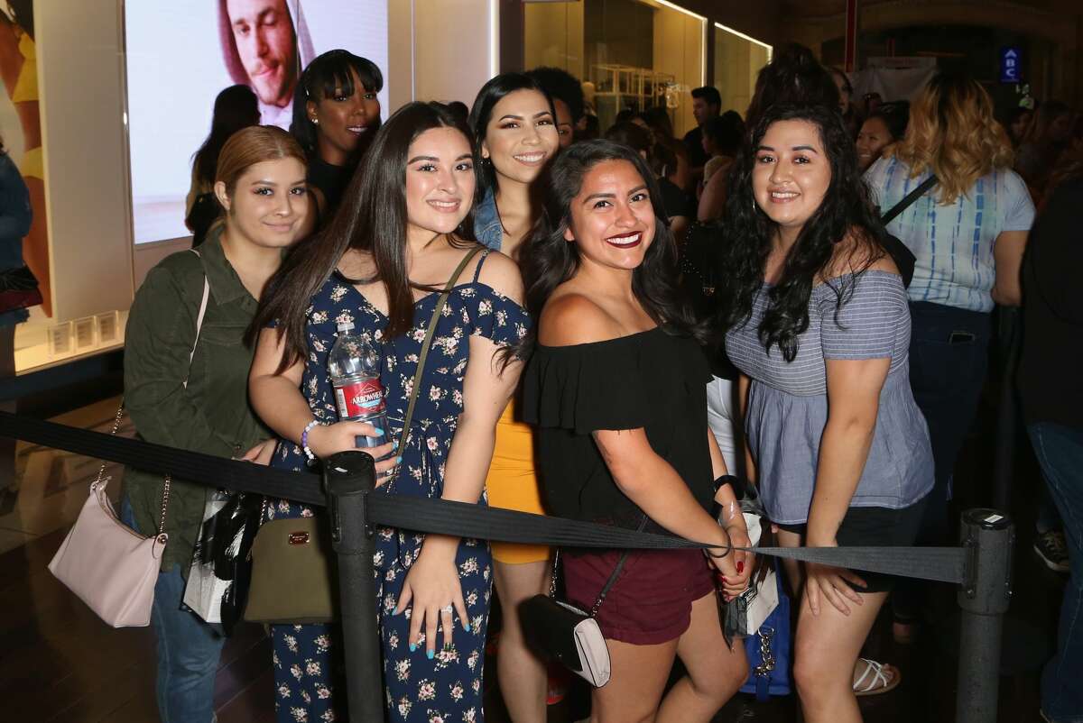 Customers pose during a Morphe store opening at the Miracle Mile Shops at Planet Hollywood Resort & Casino on June 16, 2018, in Las Vegas.
