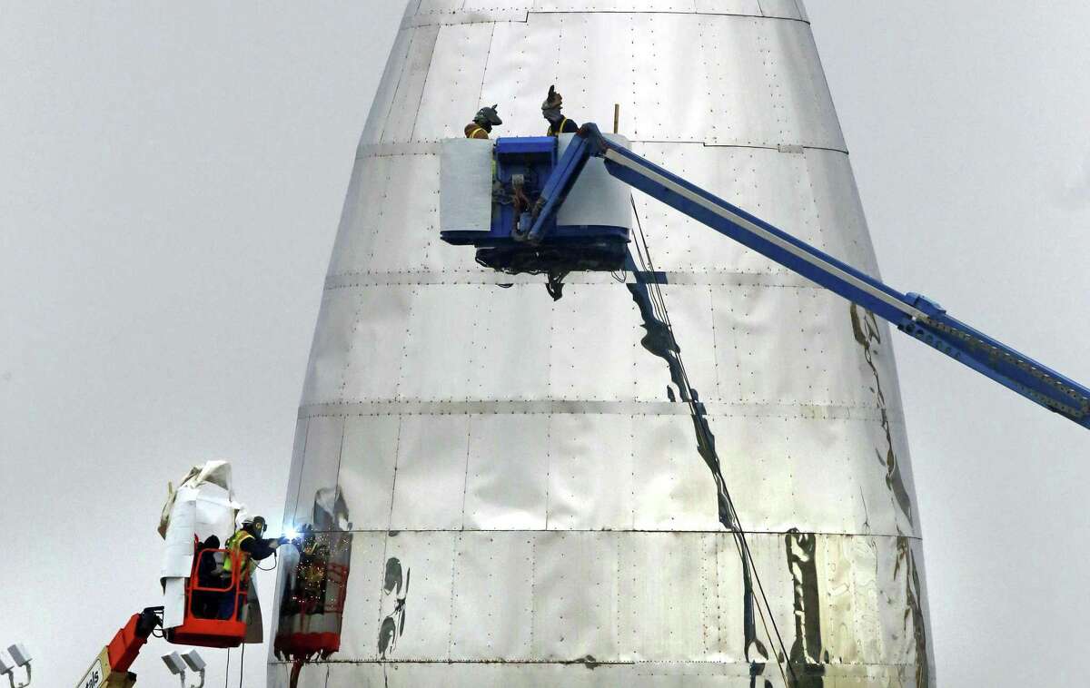 SpaceX continues work on Jan. 2, 2019, on its prototype starship that is being called "test hopper" at the Boca Chica Beach site, near Brownsville in South Texas. SpaceX CEO Elon Musk plans to launch a rocket to Mars by 2024.